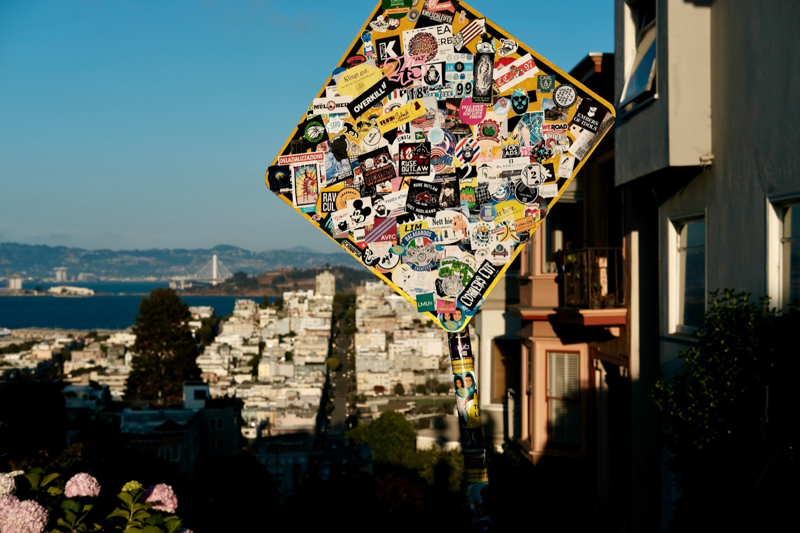 A colorful heart-shaped installation covered in stickers in San Francisco